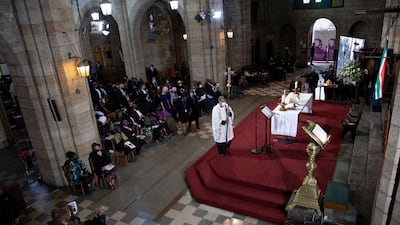 The procession makes its way to the front of the cathedral. AFP