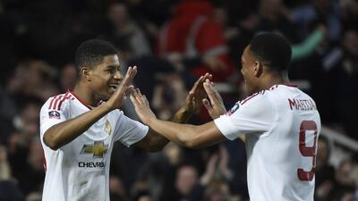 Marcus Rashford celebrates with Anthony Martial after scoring the first goal for Manchester United. Reuters / Toby Melville