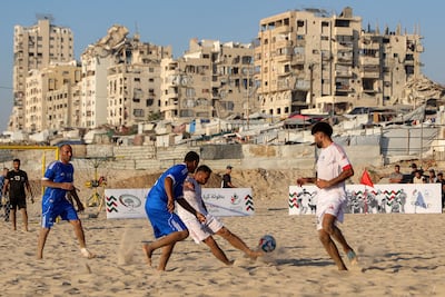 Displaced Palestinians compete in a beach football tournament in Gaza city. AFP