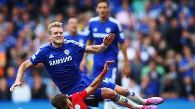 Andre Schurrle of Chelsea is tackled by Dean Hammond of Leicester City and receives a yellow card for the challenge during the Barclays Premier League match between Chelsea and Leicester City at Stamford Bridge on August 23, 2014 in London, England. (Photo by Paul Gilham/Getty Images)