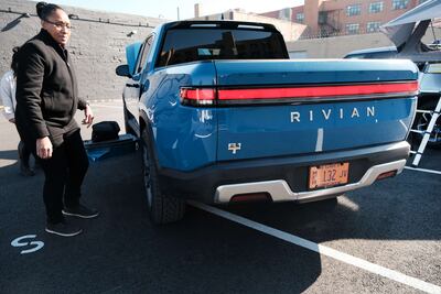 Backed by deep-pocketed companies such as Amazon and Ford Motor, Rivian is hitting the public markets as it looks to make a dent in the electric vehicle market led by Tesla. AFP