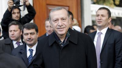 Turkish President Tayyip Erdogan smiles as he leaves from Eyup Sultan mosque in Istanbul. Huseyin Aldemir / Reuters