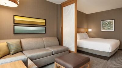 Rooms are well-appointed, with not only a comfy king-size bed and desk but also an L-shaped sofa, footstool and laptop table. Courtesy Hyatt DC