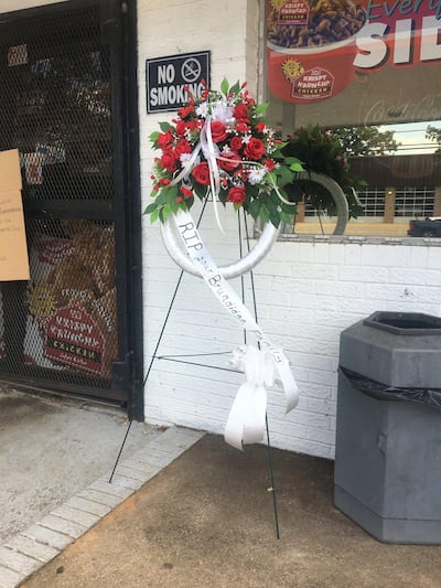 A wreath laid at the scene of the murder. Photo: Randi Hildreth / WSFA/WDFX