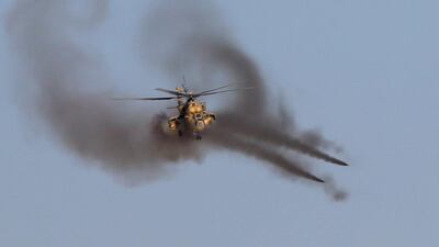 An Iraqi air force helicopter fires missiles at ISIL targets. Goran Tomasevic / Reuters