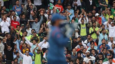 Pakistan and India fans watch a match between the sides at The Oval in England in 2009. Hamish Blair / Getty Images / June 3, 2009