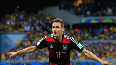 Germany's forward Miroslav Klose celebrates after scoring during the semi-final football match between Brazil and Germany at The Mineirao Stadium in Belo Horizonte on July 8, 2014. An afterthought when the tournament began, Klose has once again worked his way to a prominent post. Adrian Dennis / AFP
