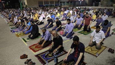 Palestinians pray the Tarawih (extended night prayers) in Jenin school in the West Bank city of Jenin. EPA