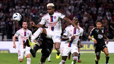 Lyon's Brazilian midfielder Thiago Mendes (front) fights for the ball with Ajaccio's Congolese forward Bevic Moussiti-Oko. AFP