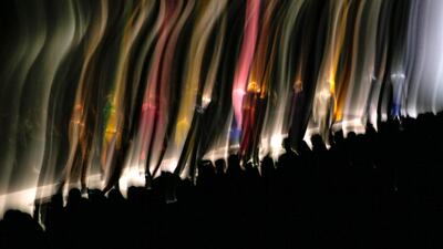 A picture taken with a long-time exposure shows models presenting creations by Russian designer Asya Solov’eva during the Moscow Fashion Week. Sergei Ilnitsjt / EPA