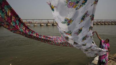A Hindu devotee dries her clothes after taking a dip in the River Ganges on occasion of "Basant Panchmi" in Allahabad. Rajesh Kumar Singh / AP Photo