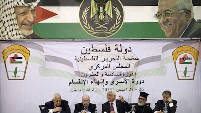 Palestinian President Mahmoud Abbas, middle, speaks during a meeting with the Palestinian Central Council, a top decision-making body, at his headquarters in the West Bank city of Ramallah on April 26. Majdi Mohammed / AP