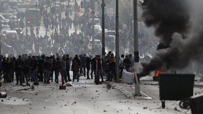 Palestinian protesters clash with Israeli forces near an Israeli checkpoint in Bethelem on December 7, 2017. Thomas Coex / AFP
