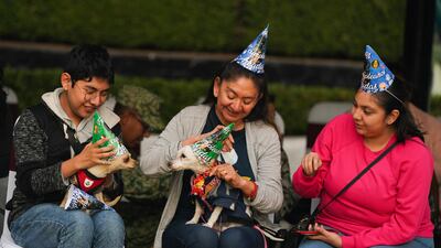 Guests getting into the party spirit. AP