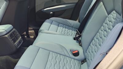 The cabin is reminiscent of a sports car, with the back featuring two sculpted bucket seats and small side windows.