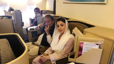 Ousted Pakistani Prime Minister Nawaz Sharif and his daughter Maryam sit on a Lahore-bound flight due for departure, at Abu Dhabi International Airport, on July 13, 2018. Reuters