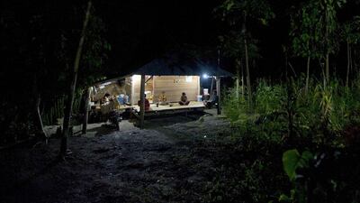 Family members gather in their house powered by electricity from mini-hydroelectric generators built beside a river dam in Kamanggih village. Until two years ago, most people in Kamanggih on the island of Sumba had no power at all. Romeo Gacad / AFP