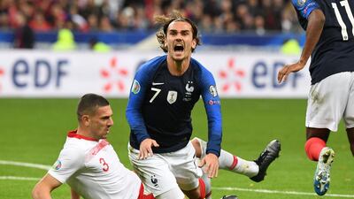 France forward Antoine Griezmann gets tackled by Turkey's defender Merih Demiral at the Stade de France. AFP