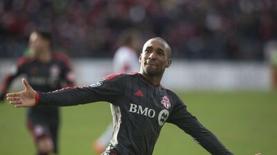Toronto FC's Jermain Defoe celebrates after scoring against DC United on Saturday. Chris Young / AP / The Canadian Press / March 22, 2014