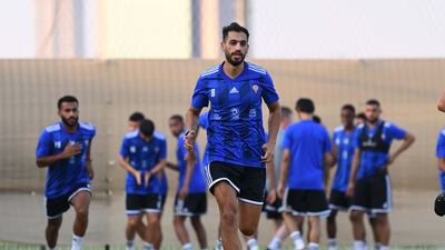 Majed Hassan runs during a UAE training session.