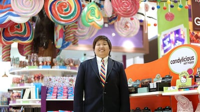Kriz Huang, cluster manager at the Candylicious store in Dubai Mall, left Singapore in her desire to work abroad. Pawan Singh / The National