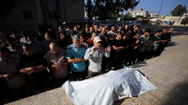 Mourners attend the funeral of one of three Palestinians killed in an Israeli strike, at Al Shifa Hospital in Gaza city, on October 25. Reuters