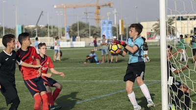 CS Luceafarul goalkeeper saves a goal attempt from Muscat Football Academy in the Under 14 finals match at the Manchester City Abu Dhabi Cup. Victor Besa / The National