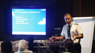 BA’s Captain Steve Allright tells his students they can conquer their fears with simple techniques during the Flying with Confidence course in the Capital Club, Dubai. Satish Kumar / The National