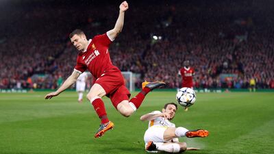 Roma's Alessandro Florenzi in action with Liverpool's James Milner. Carl Recine / Reuters