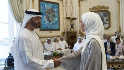 Sheikh Mohamed receives a member of the Young Arab Media Leaders Programme, during a Sea Palace barza. Hamad Al Kaabi / Ministry of Presidential Affairs
