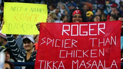 An fan holds a banner supporting Federer of Switzerland during the Dubai Duty Free Tennis Championships final. Marwan Naamani / AFP