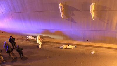 3rd prize, Contemporary Issues Single: Police arrive at a crime scene where two bodies hang from a bridge and another three are on the floor. They had been killed by organized crime in retaliation against other criminal groups in Mexico. Christopher Vanegas, La Vanguardia / El Guardian / AP Photo