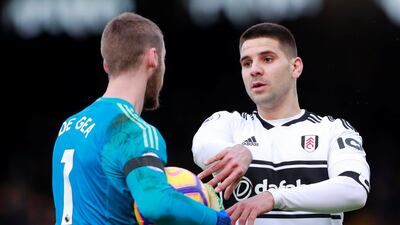 Fulham's Aleksandar Mitrovic clashes with Manchester United's David de Gea. Reuters