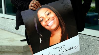 A protester with a poster of Ajike Owens at the Marion County Courthouse in Ocala, Florida. AP