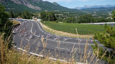 The pack speeds downhill during the 17th stage of the Tour de France. AP