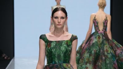 Emerald green gowns with abstract blooms and buds and floaty trains. Courtesy Michael Cinco and Couturissimo