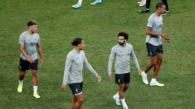 Salah, van Dijk and Oxlade-Chamberlain with team mates during training. Reuters