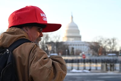 A Trump supporter wears a 'Make America Great Again' hat near the US Capitol on Monday. AFP