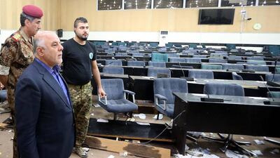 Iraqi Prime Minister Haider Al Abadi inspects the damage caused by protesters after storming the Iraqi parliament building in Baghdad's fortified Green Zone, Baghdad, Iraq, 01 May 2016. EPA/IRAQI PRIME MINISTER OFFICE