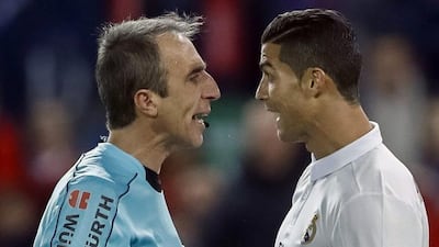 Real Madrid’s Portuguese striker Cristiano Ronaldo, right, argues with referee David Fernandez Borbalan. Emilio Naranjo / EPA