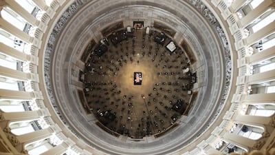 The casket of civil rights pioneer and longtime US Representative John Lewis is placed by a US military honour guard at the center of the US Capitol Rotunda to lie in state in Washington on July 27, 2020. Jonathan Ernst / Reuters