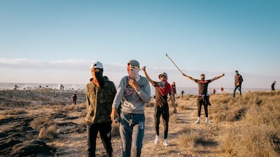 Young protesters regroup across from the Agareb landfill after being driven back by tear gas. Photo: Erin Clare Brown / The National