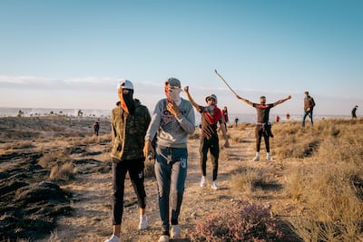 Young protesters regroup across from the Agareb landfill after being driven back by tear gas on Wednesday. Photo: Erin Clare Brown / The National