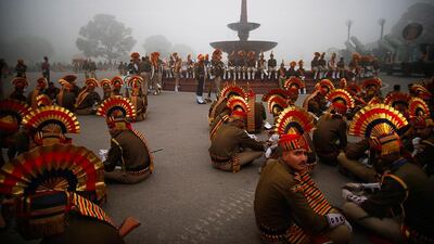 Indian soldiers wait before the beginning of rehearsals for the Republic Day parade in New Delhi. Saurabh Das / AP Photo