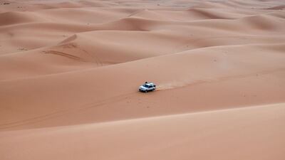 A jeep drives through the sands in the 'Saed desert ', 110Km eastern of Riyadh City. AFP
