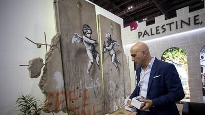 The 'replica separation barrier' created by British street artist Banksy stands. Reuters