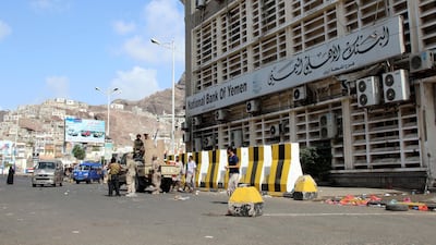 Southern Yemeni fighters are seen outside a bank in the port city of Aden, Yemen on January 30, 2018. Fawaz Salman / Reuters