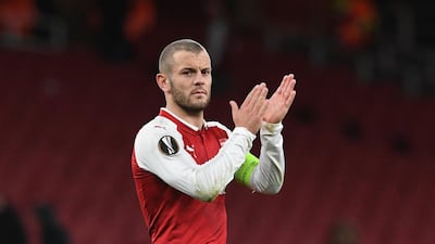 Arsenal midfielder Jack Wilshere applauds fans after his side's win in the Europa League, even though there were large areas of the ground empty. Facunda Arrizabalaga / EPA
