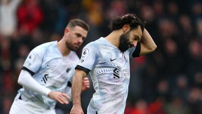 Salah reacts after missing a penalty. Getty
