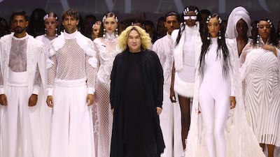 Amato designer Furne One on with models on the runway at Arab Fashion Week on March 28, 2022. Getty Images
